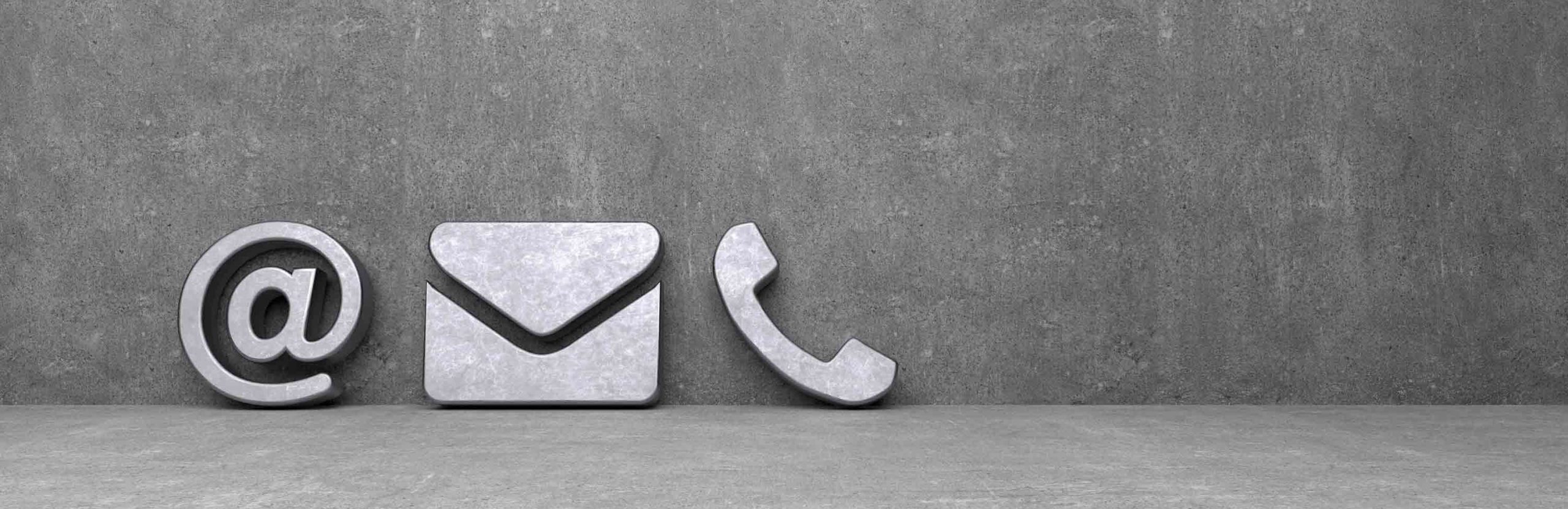 Concrete icons of an envelope and a telephone handset on a gray background.